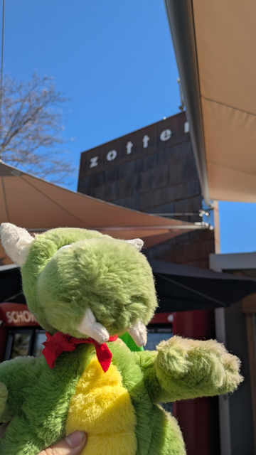 KDE mascot Konqi in front of Zotter chocolate factory