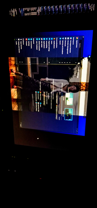  The photograph composed in total darkness shows an IPS LED computer screen displaying the K Desktop Environment with a dark blue theme. The screen is divided into two main sections: the top section shows a settings menu with various options such as "Audio and Sound," "Display and Monitor," "Input Devices," "Hardware and Devices," "Network," "Settings," "Connections," "User Feedback," "Online Accounts," "Accessibility," "Region and Language," "Notifications," "Personalization," "Search and Shutdown," "Shortcuts and Startup," "Workspace Behavior," and "Appearance." The bottom section features a wallpaper of a gorgeous woman standing in a room with a wooden floor and a window in the background. The woman is wearing a white top and a black skirt with a lace pattern, and she is smiling. The screen also shows a sidebar with options like "General," "Global Themes," "Connections," "Appearance Style," and "User Style." The time displayed on the screen is 22:38, and the date is the 15th of May. The overall image is in subtle Bokeh, because of the translucent effect programmed in KDE
The screen is surrounded by a dark background, and has been captured with a puny Android analogue sensor smaller than the tip of my Pinky nail

 Ovis2-8B

🌱 Energy used: 0.264 Wh